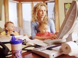Mother with children working from home.